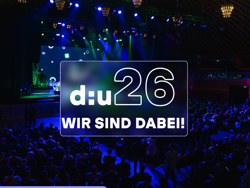Das Bild zeigt die Bühne bei der data:unplugged 2025 und den Termin für die Messe 2026. Der abgebildetet Text kündigt an, dass wir auf der Messe 2026 dabei sind.